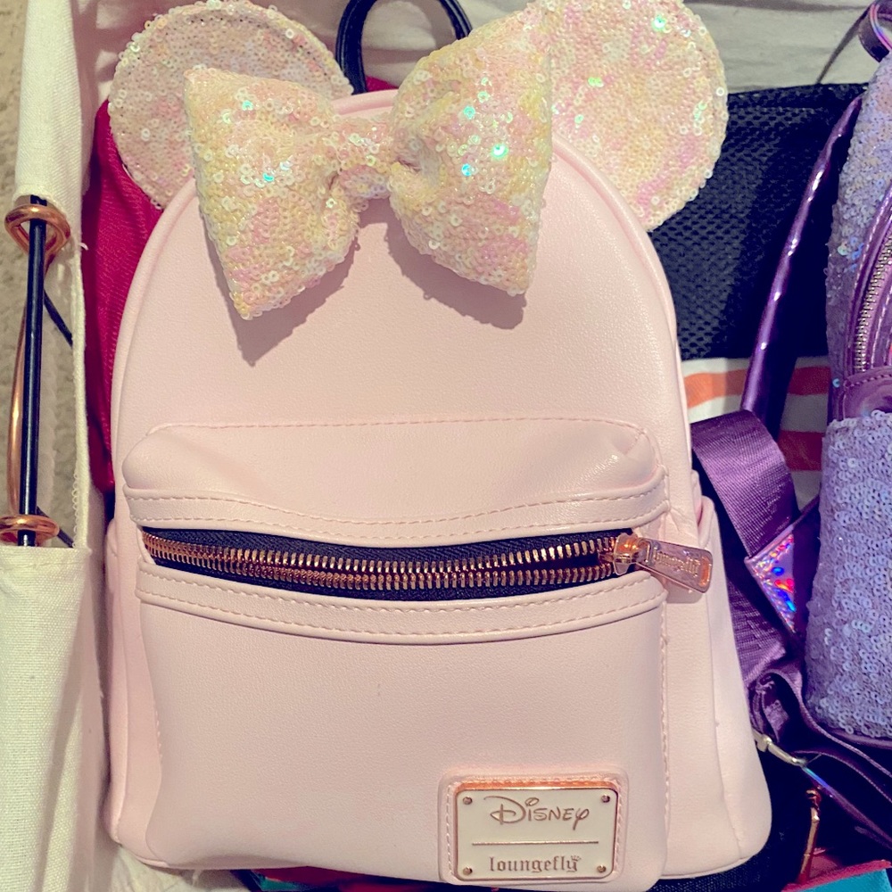 Pink Mickey ear loungefly backpack.